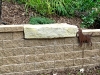 Looking to the other side of the bench, you can see Dana's answer to the tough question, How do you transition from manufactured wall block to natural stone?