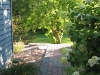 The brick path beckons you to the softly sunny backyard.  The PeeGee hydrangea bushes nod their heavy heads. 